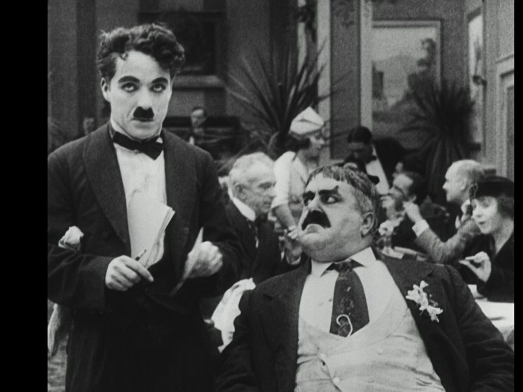 Charlie Chaplin and Eric Campbell in The Rink (1916) Spanish Divisa Blu-ray screenshot