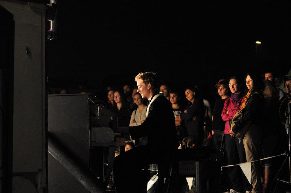 Seamas Carey at his keyboard-cum-piano playing for an appreciative audience