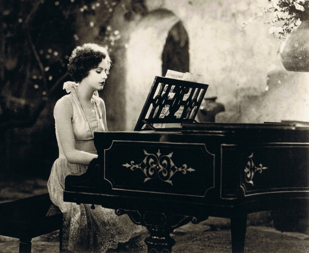 Greta Garbo playing a piano in Torrent (1926)